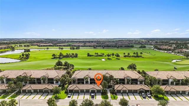a view of swimming pool and outdoor seating