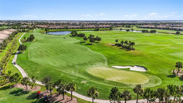 a view of a golf course with a swimming pool