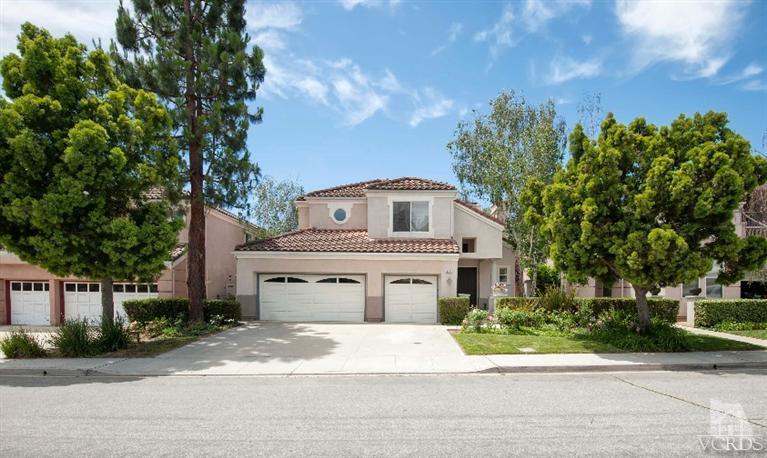 4317 Timberdale Road Moorpark, CA 93021 - Photo 3 of 26 a front view of a house with a garden and trees