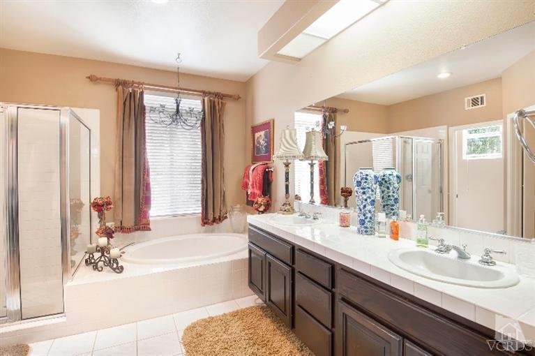 4317 Timberdale Road Moorpark, CA 93021 - Photo 22 of 26 a spacious bathroom with sink double vanity shower and a mirror