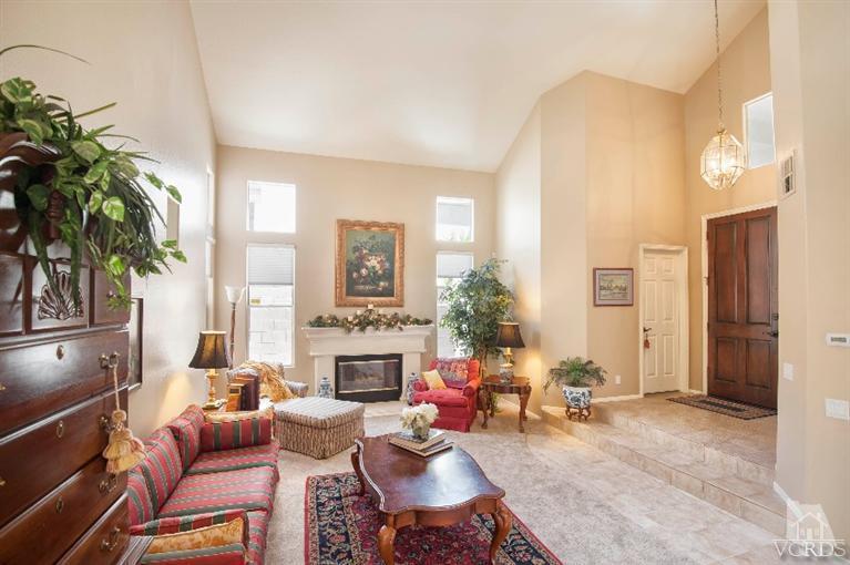 4317 Timberdale Road Moorpark, CA 93021 - Photo 5 of 26 a living room with furniture potted plant and a fireplace