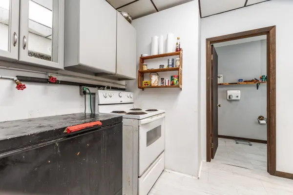 a kitchen with stainless steel appliances granite countertop a sink and a stove