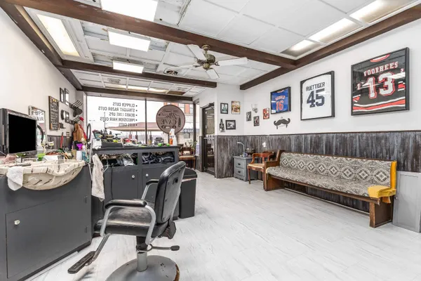 a living room with furniture and flat screen tv