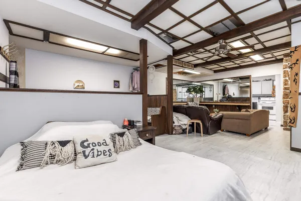 a bedroom with furniture and a bed