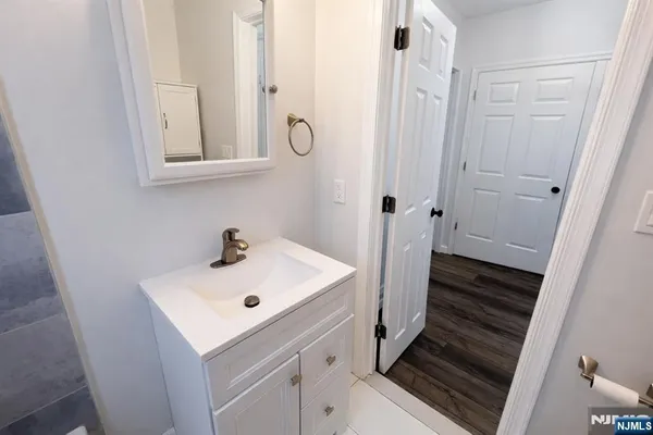 a bathroom with a sink and mirror