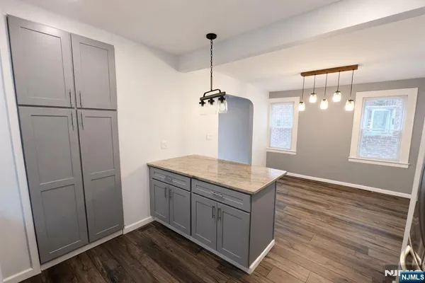 a kitchen with a refrigerator and countertop
