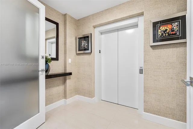 wooden floor with white walls and windows