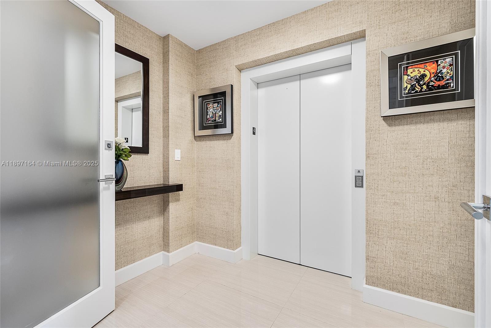 2720 Donald Ross Road, Unit 406 Palm Beach Gardens, FL 33410 - Photo 11 of 35 wooden floor with white walls and windows