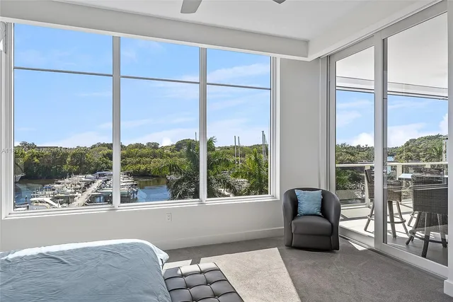 a living room filled with furniture and a window