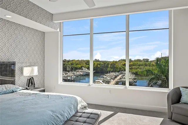 a bedroom with a large bed and a window