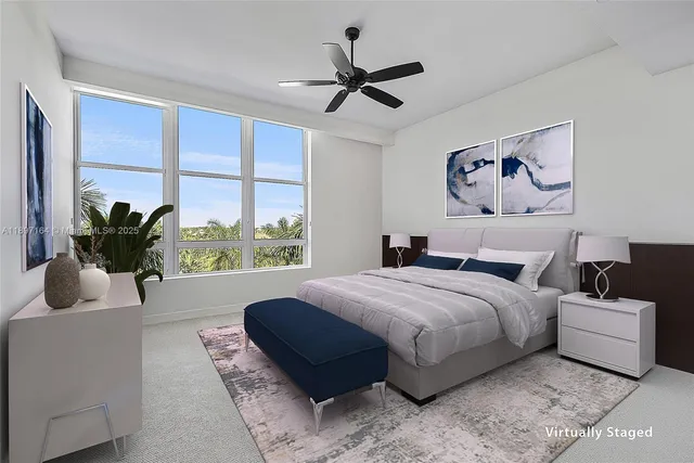 a bed room with a bed and a large window