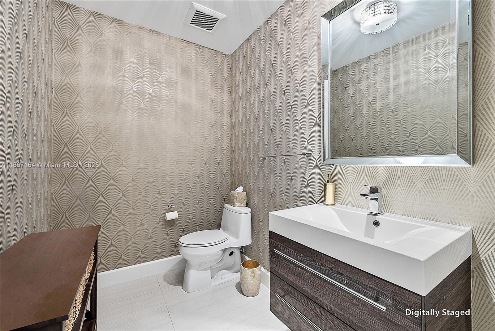 2720 Donald Ross Road, Unit 406 Palm Beach Gardens, FL 33410 - Photo 17 of 35 a bathroom with a sink a toilet and a mirror