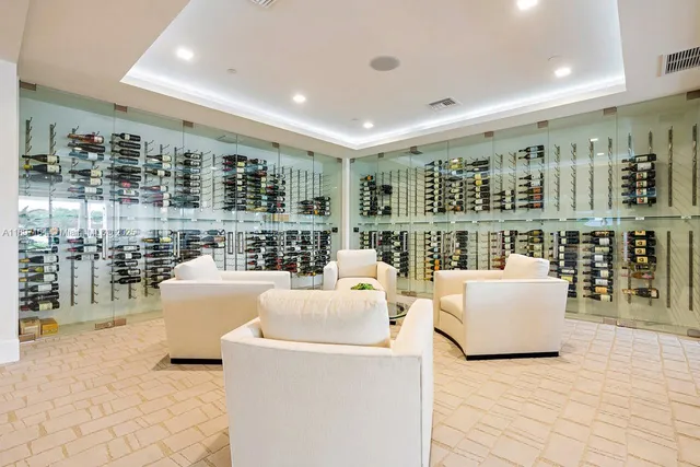 a living room with furniture and a book shelf