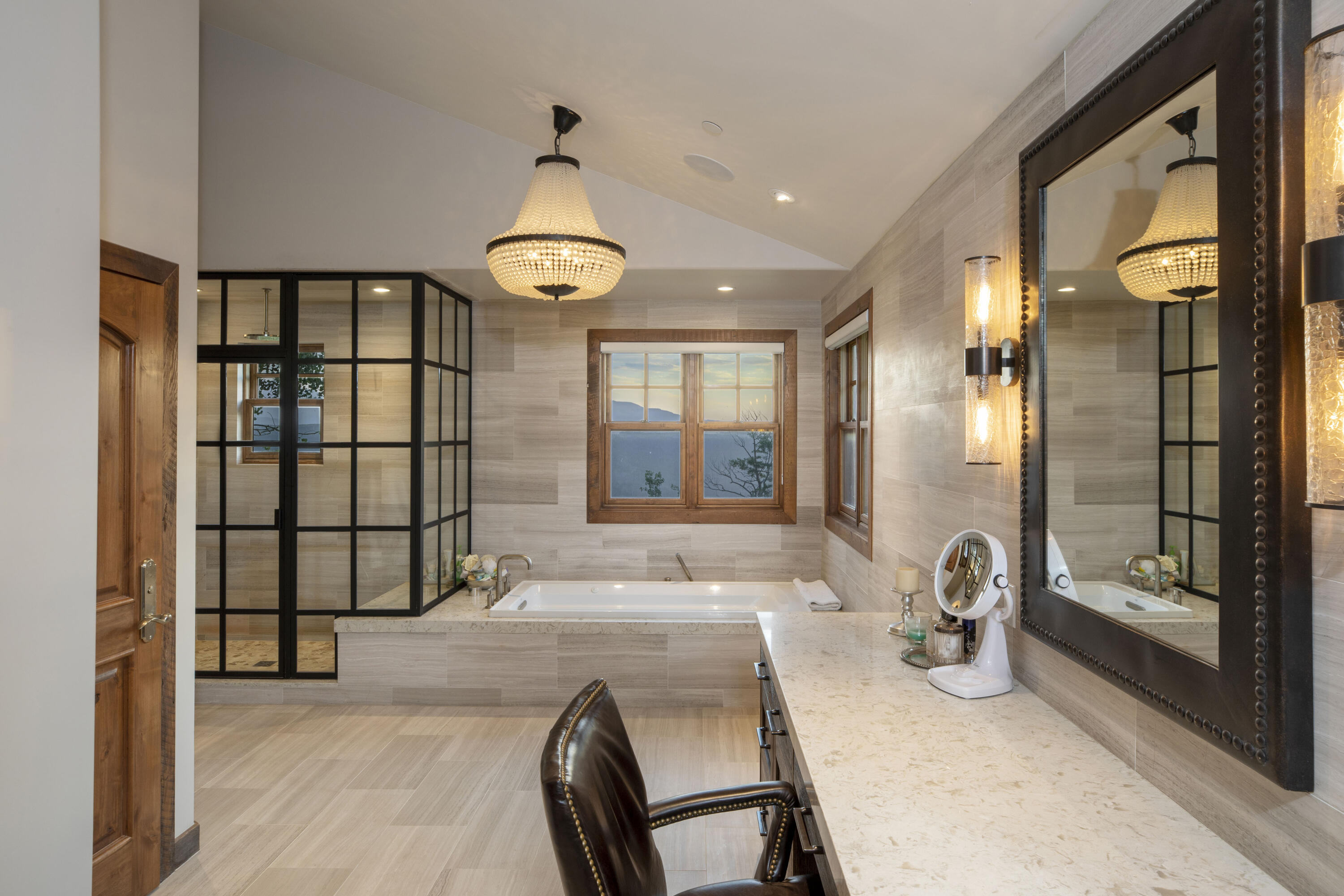 7039 Last Dollar Road Telluride, CO 81435 - Photo 20 of 52 a spacious bathroom with a granite countertop tub and a large window