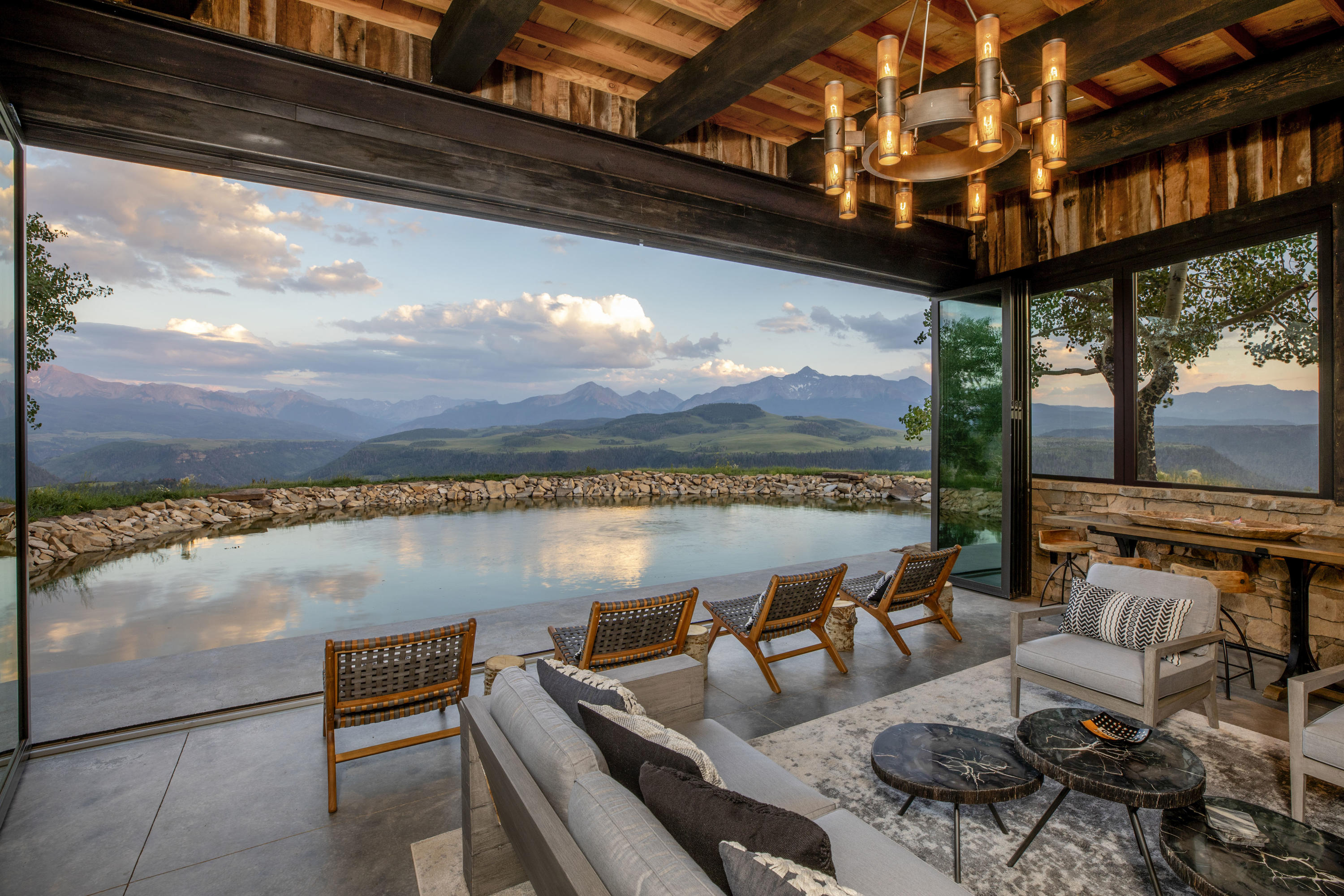 7039 Last Dollar Road Telluride, CO 81435 - Photo 2 of 52 a roof deck with a table and chairs