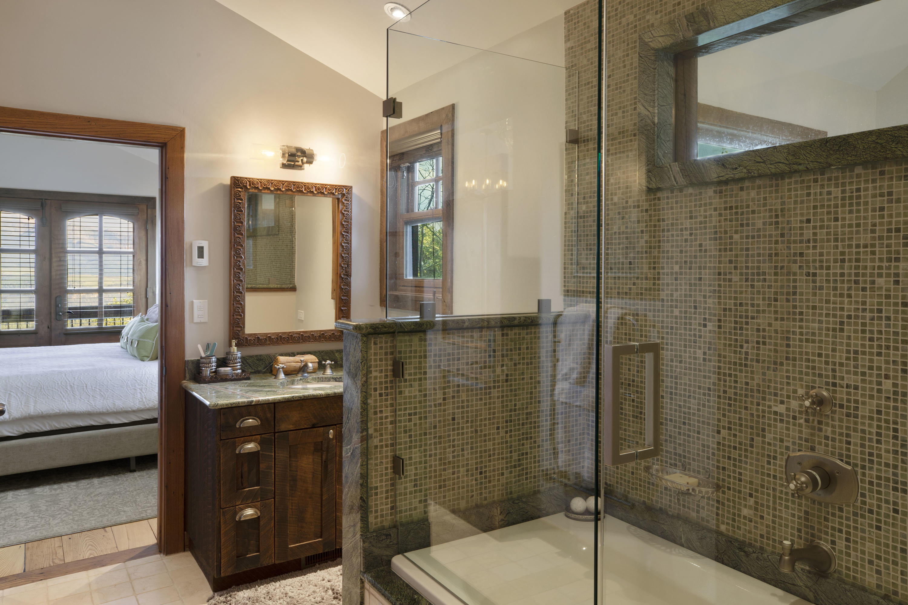 7039 Last Dollar Road Telluride, CO 81435 - Photo 27 of 52 a bathroom with a double vanity sink toilet and shower