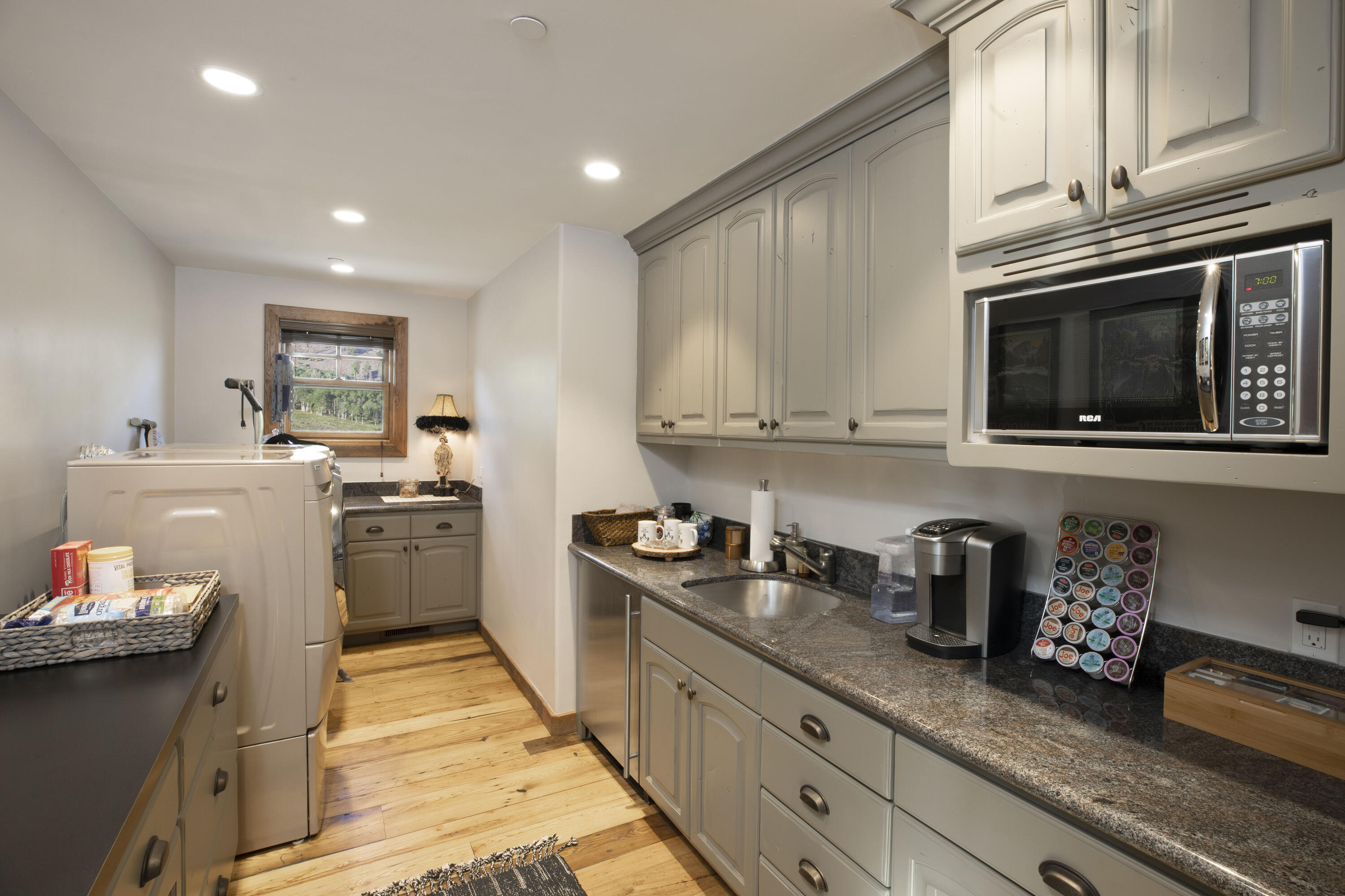 7039 Last Dollar Road Telluride, CO 81435 - Photo 30 of 52 a kitchen with stainless steel appliances granite countertop a sink a stove and cabinets