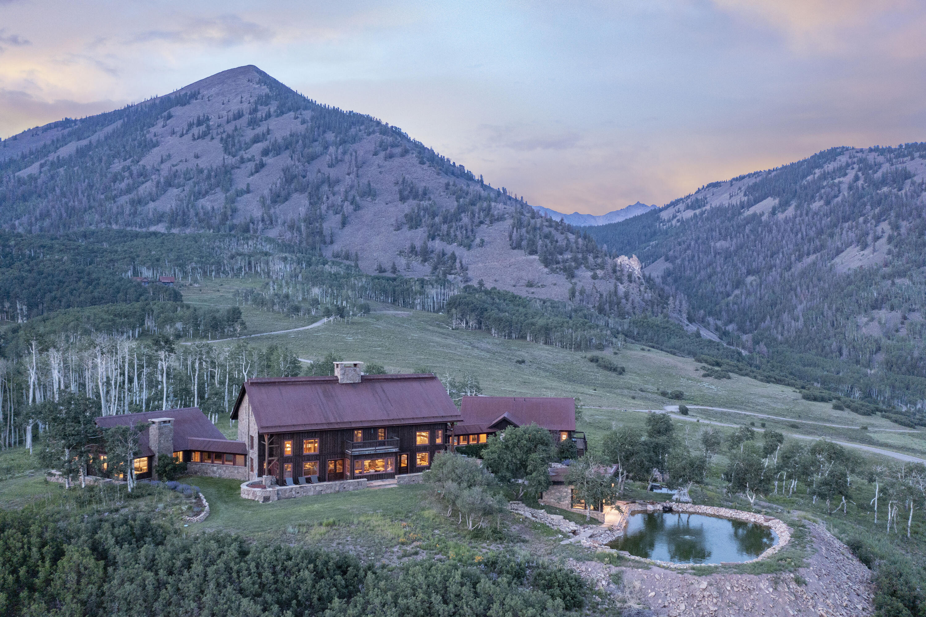 7039 Last Dollar Road Telluride, CO 81435 - Photo 3 of 52 a backyard of a house with table and chairs