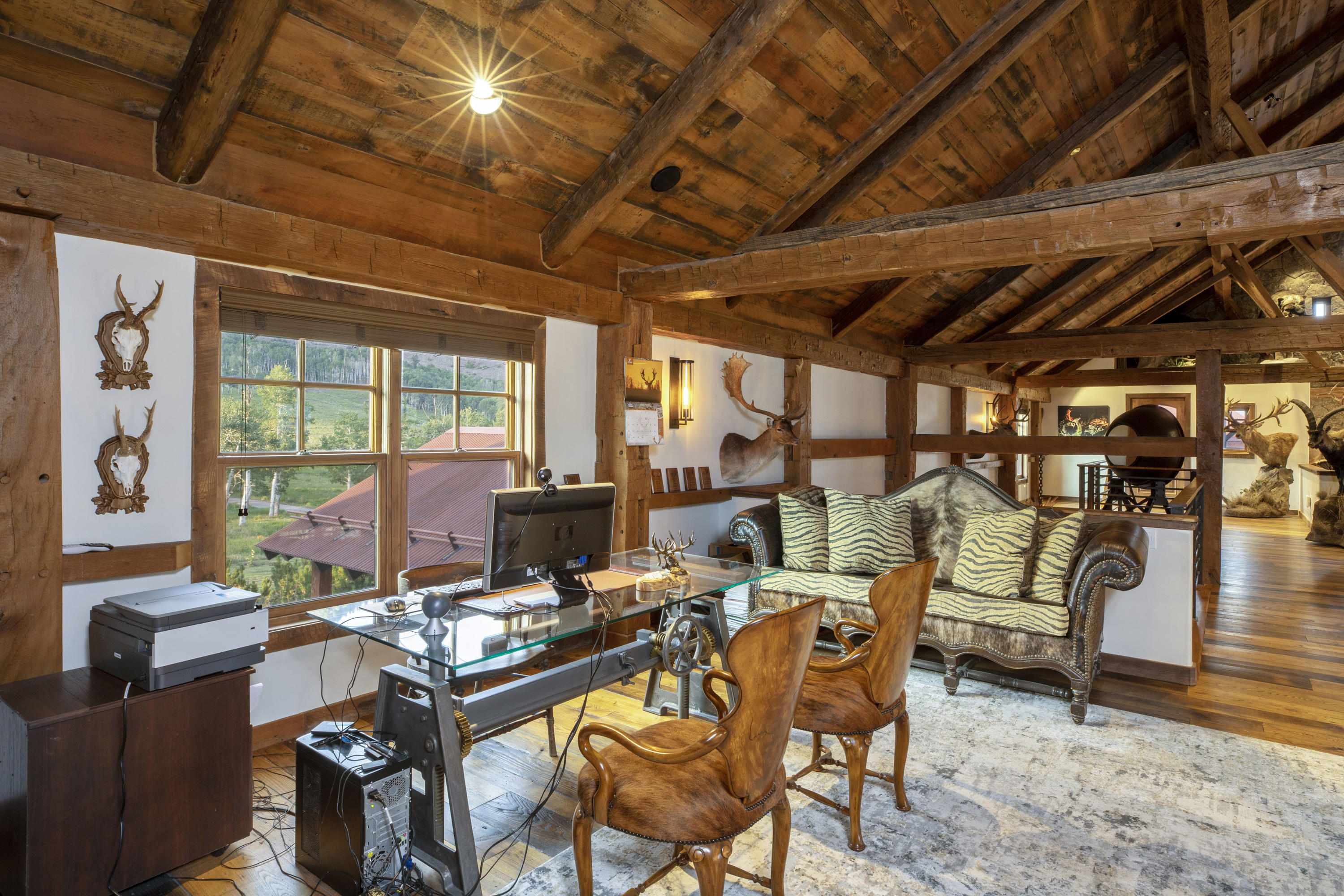 7039 Last Dollar Road Telluride, CO 81435 - Photo 33 of 52 a living room with furniture and a chandelier