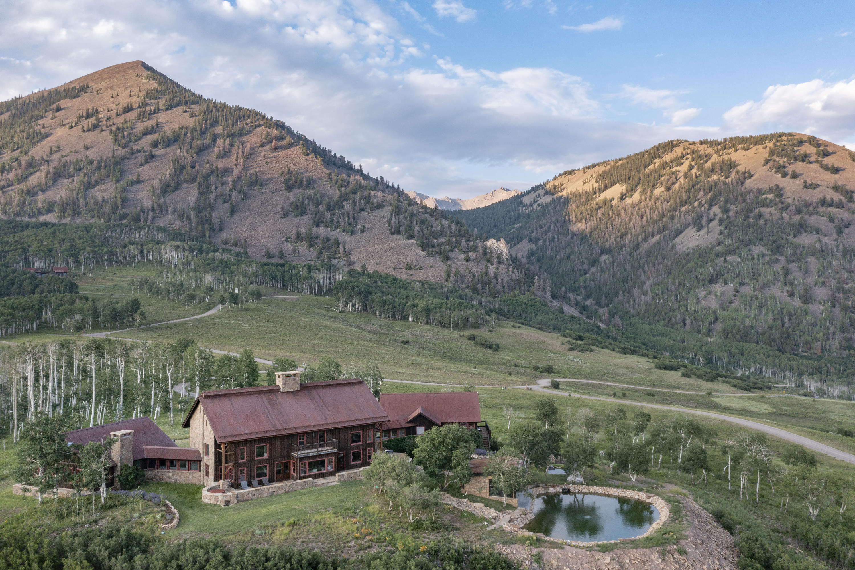 7039 Last Dollar Road Telluride, CO 81435 - Photo 43 of 52 a backyard of a house with yard and outdoor seating