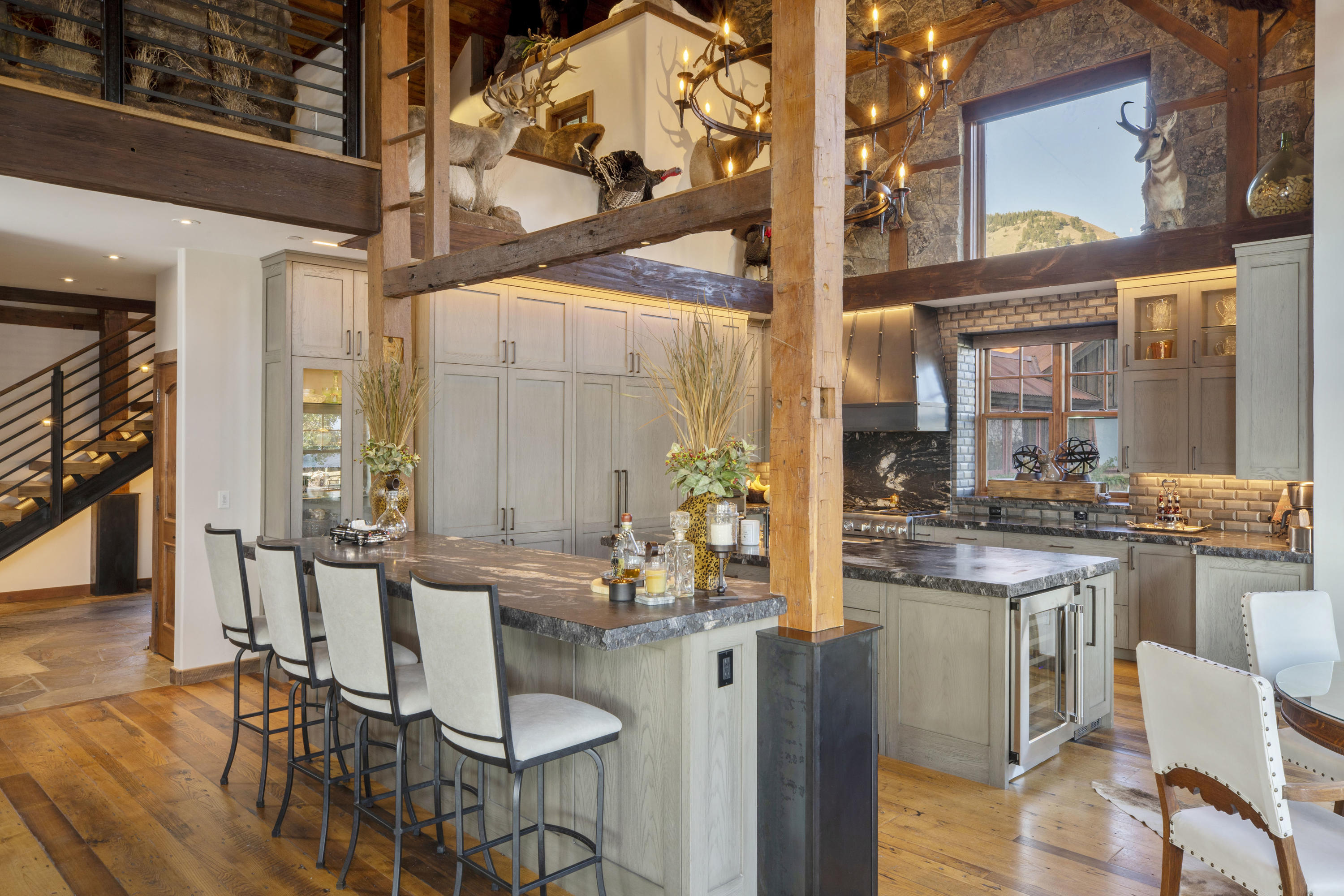 7039 Last Dollar Road Telluride, CO 81435 - Photo 8 of 52 a kitchen with stainless steel appliances granite countertop a stove and cabinets