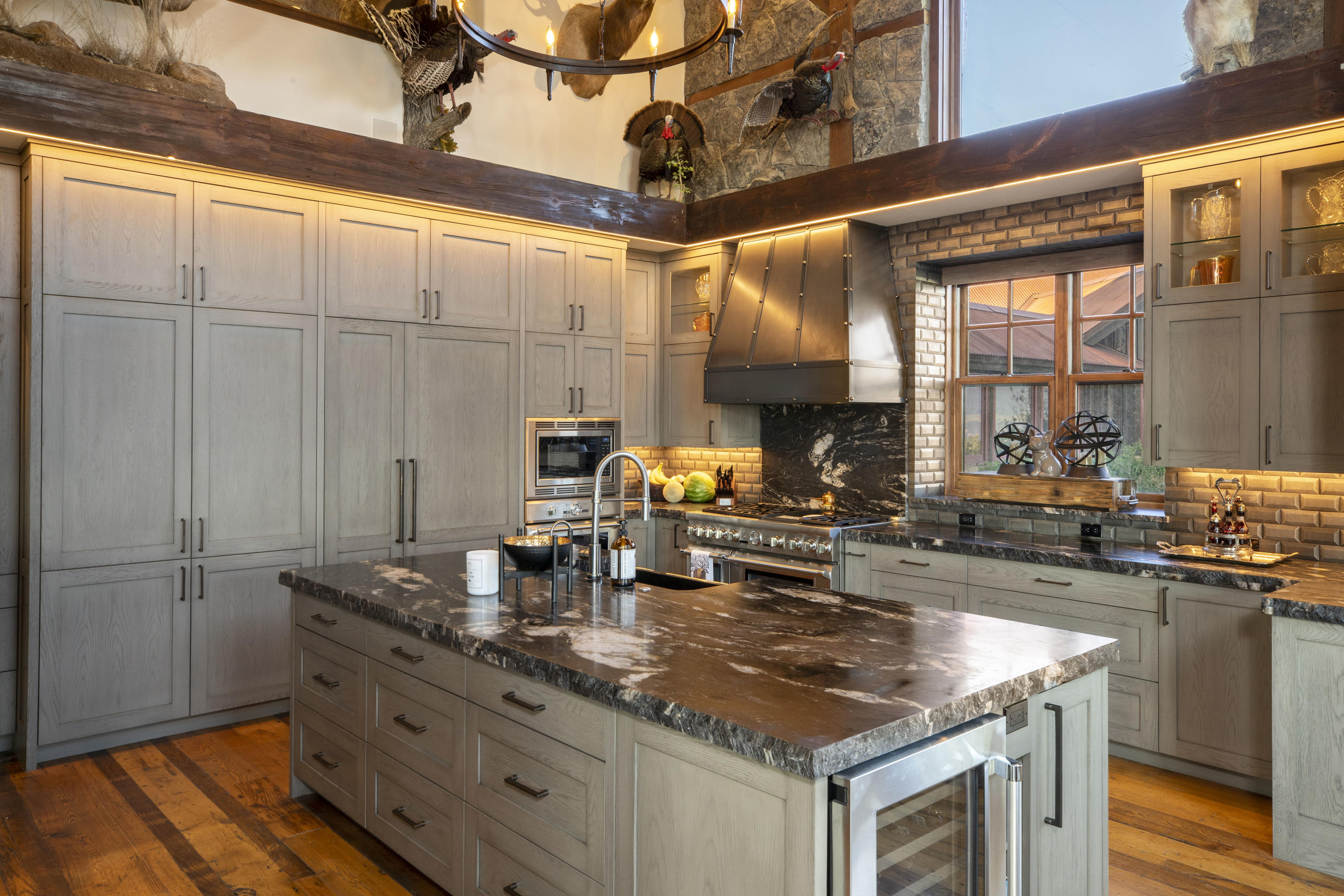 7039 Last Dollar Road Telluride, CO 81435 - Photo 9 of 52 a kitchen with granite countertop a sink and a stove next to a window