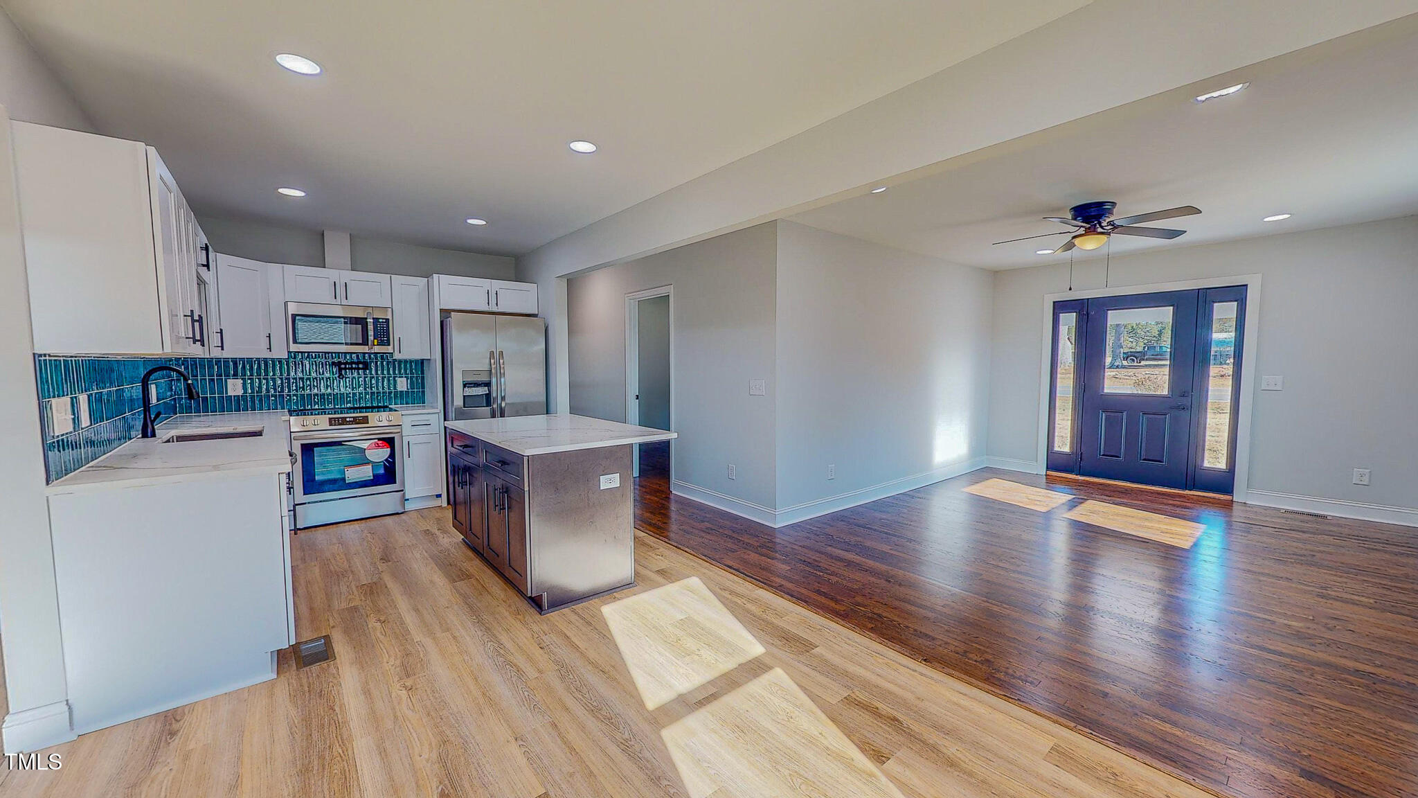 981 Country Club Road Roxboro, NC 27574 - Photo 3 of 45 a living room with stainless steel appliances furniture a kitchen view and wooden floors