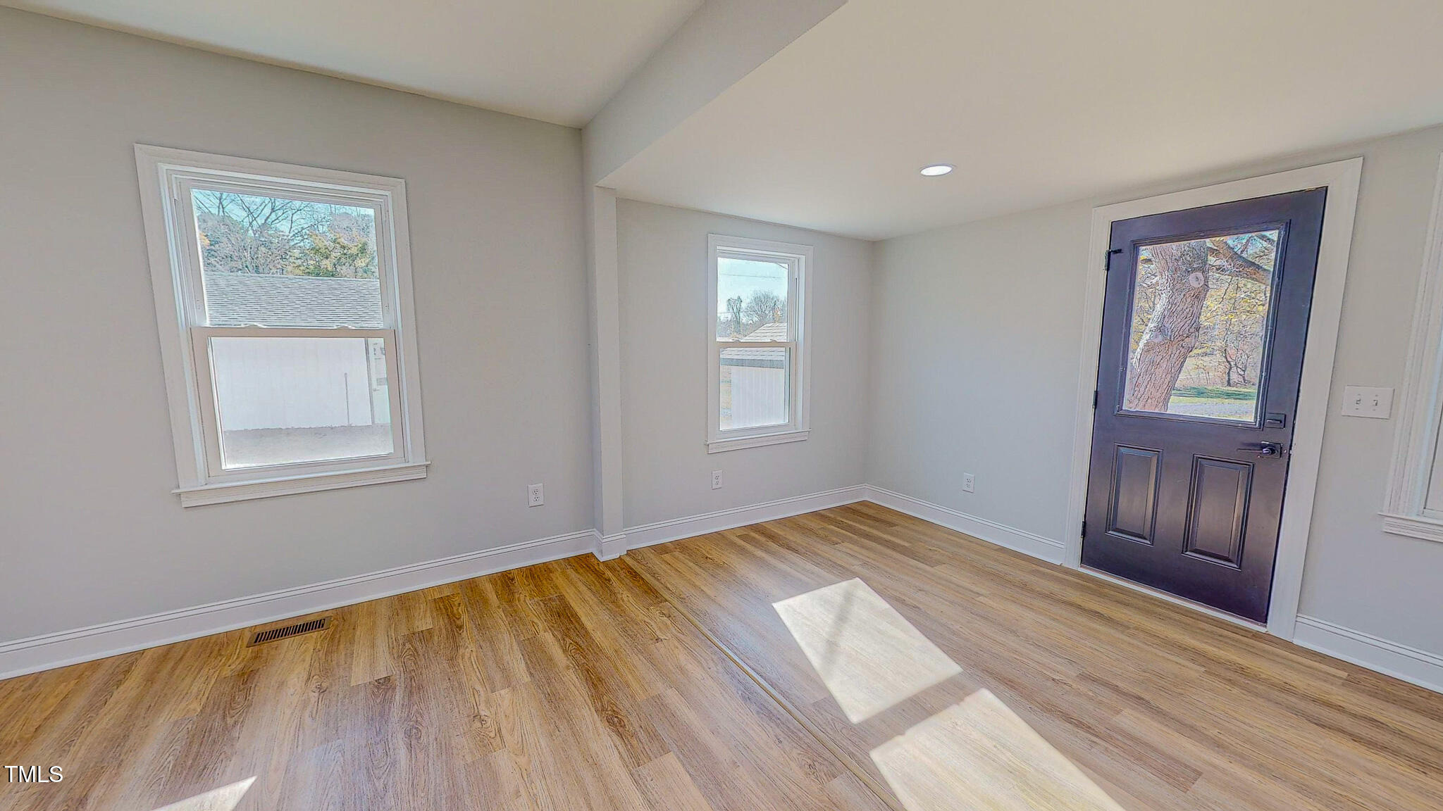981 Country Club Road Roxboro, NC 27574 - Photo 39 of 45 a view of empty room with wooden floor and fan