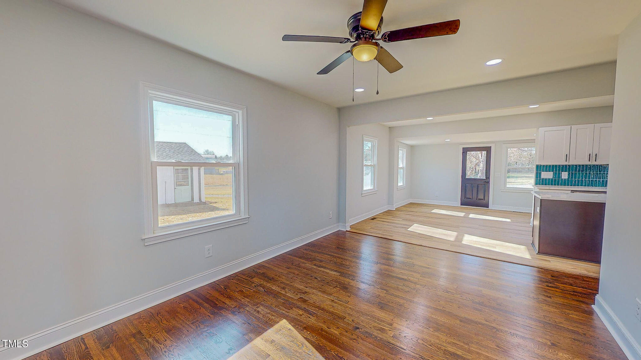 981 Country Club Road Roxboro, NC 27574 - Photo 8 of 45 a view of empty room with wooden floor and window