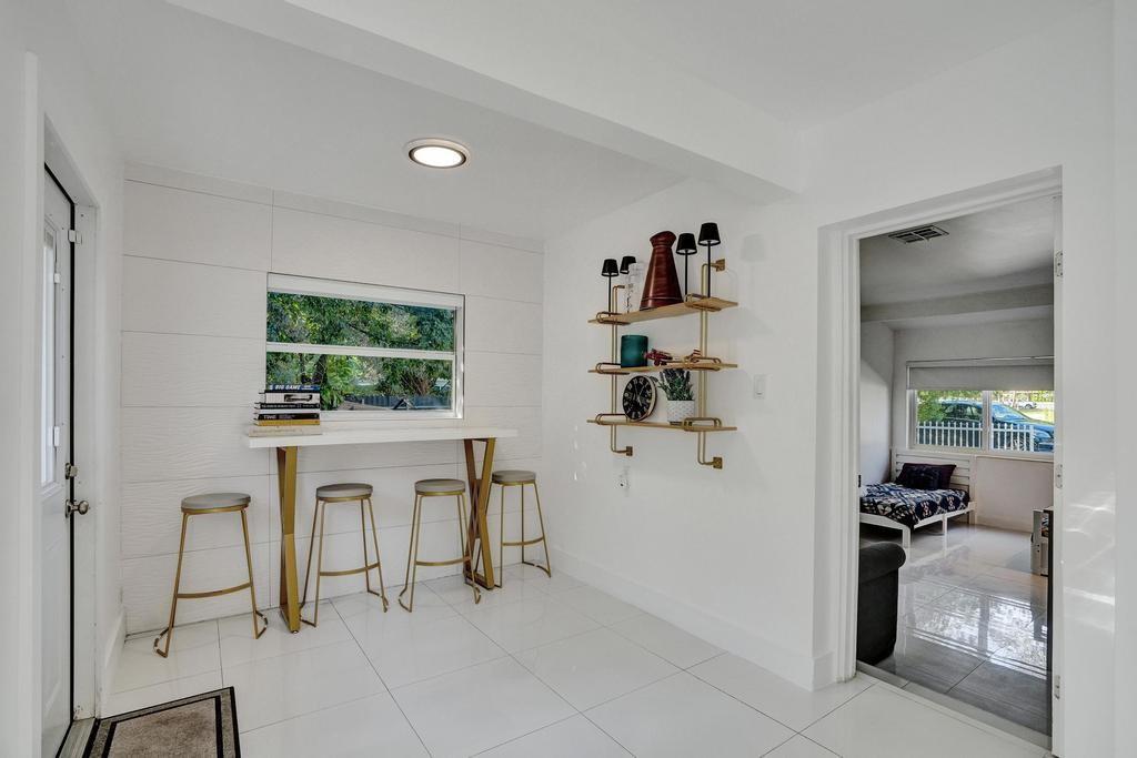 1050 Northeast 150th Street Miami, FL 33161 - Photo 29 of 50 a view of work space with furniture and a window