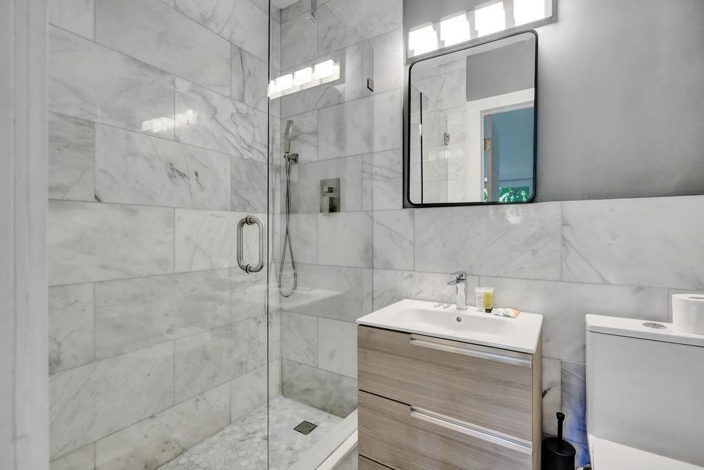 1050 Northeast 150th Street Miami, FL 33161 - Photo 40 of 50 a bathroom with a sink and shower