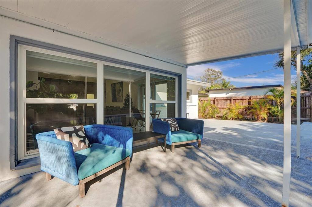 1050 Northeast 150th Street Miami, FL 33161 - Photo 46 of 50 a living room with furniture and a large window