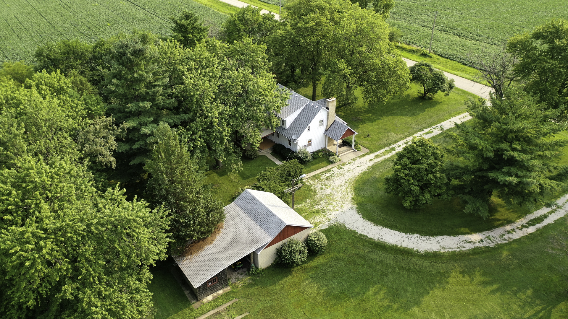 24510 South Rowell Road Elwood, IL 60421 - Photo 22 of 37 an aerial view of a house with swimming pool and trees