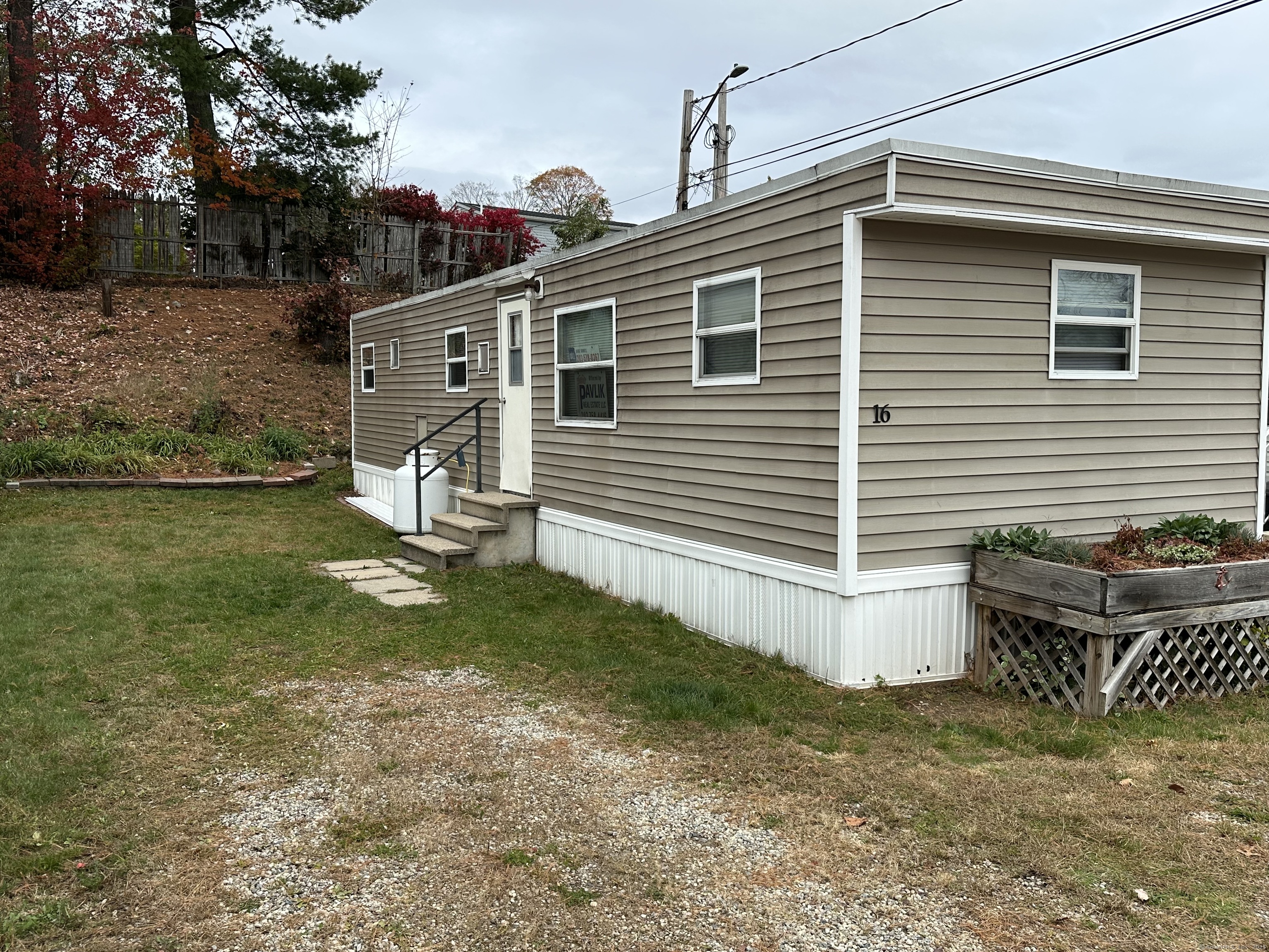 7 Andrews Street, Unit 16 Bristol, CT 06010 - Photo 1 of 1 a front view of a house with garden