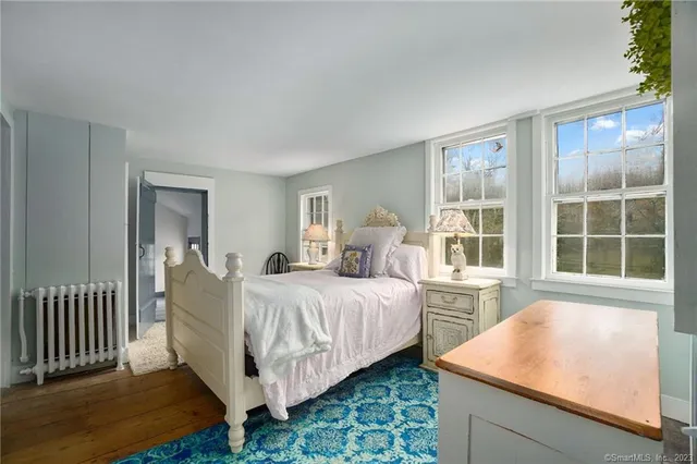 a bed room with a bed and a window