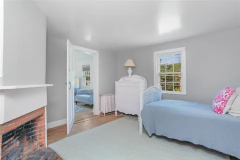 a bed room with a bed and a window