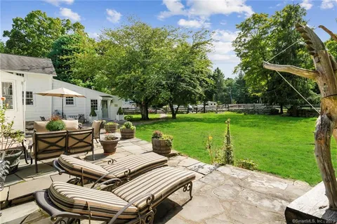 a view of a patio with a yard