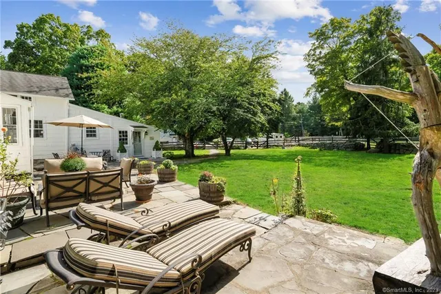 a view of a patio with a yard