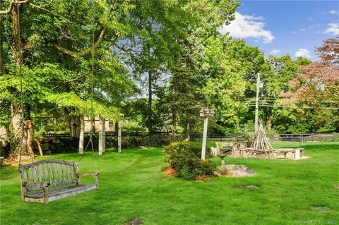 a view of a park with large trees