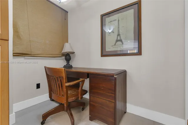 a view of a hallway with wooden floor and closet