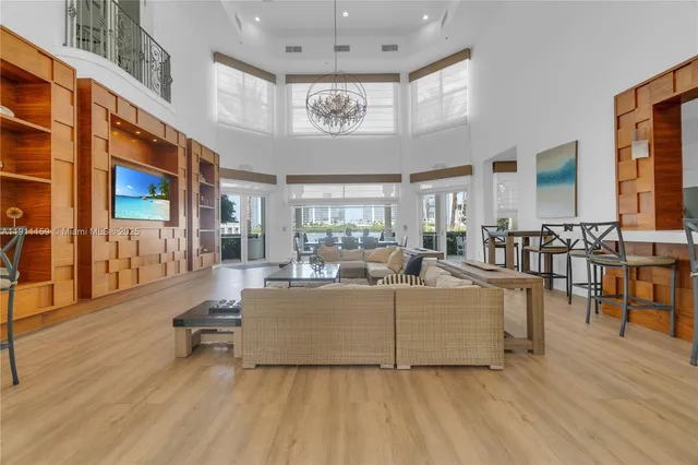 a view of living room with furniture and a chandelier
