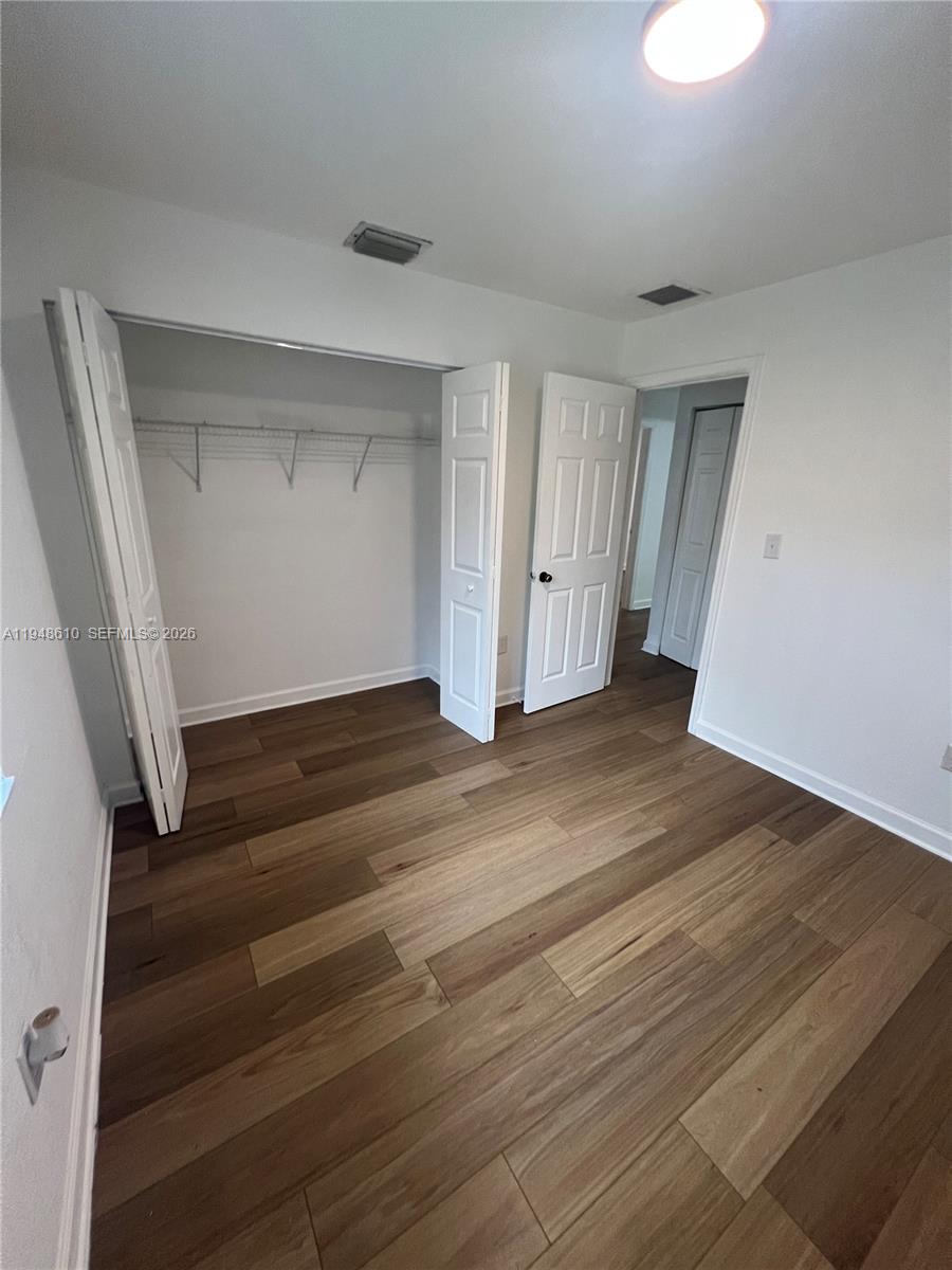 12254 Southwest 217th Street Miami, FL 33170 - Photo 27 of 40 wooden floor in an empty room