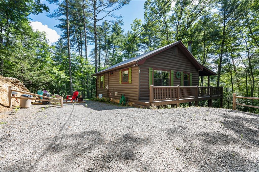 147 Rocky Road Blue Ridge, GA 30513 - Photo 1 of 1 a view of small house with a yard and garage