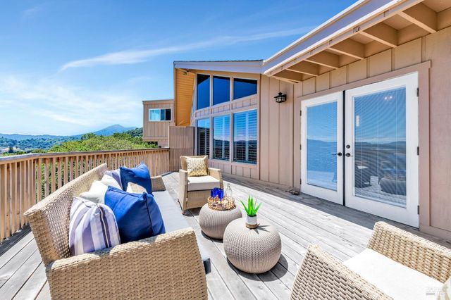 a outdoor space with patio the couch and chandelier