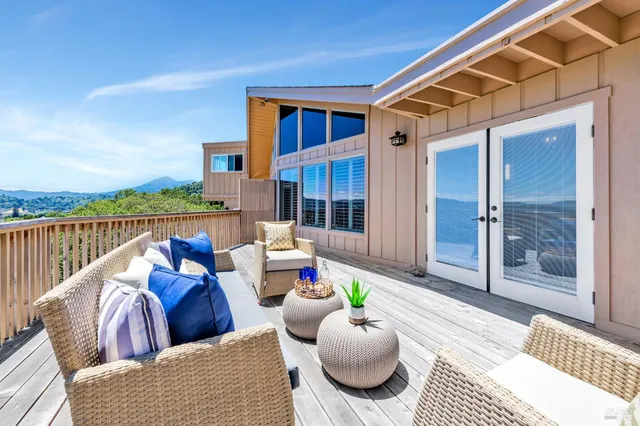 a outdoor space with patio the couch and chandelier