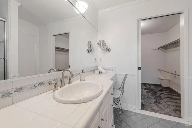 a bathroom with a double vanity sink and mirror