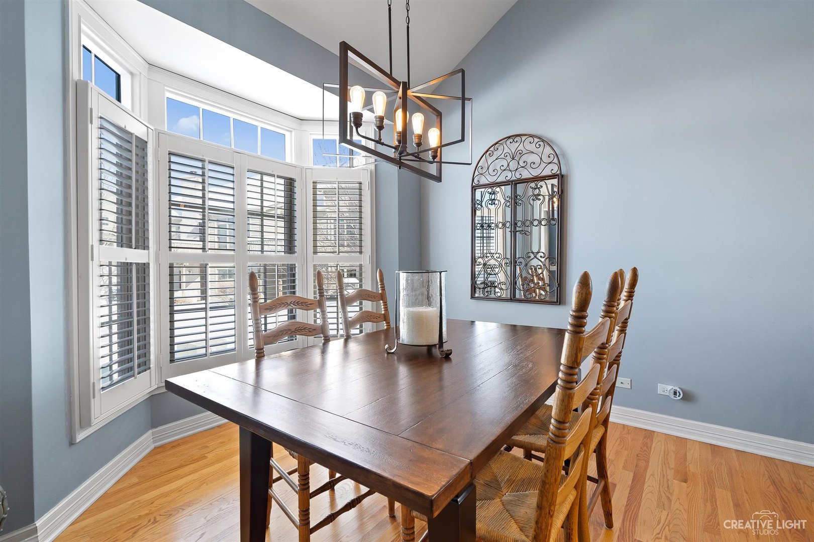 3509 Ridge Pointe Drive Geneva, IL 60134 - Photo 11 of 39 a view of a dining room with furniture window and wooden floor