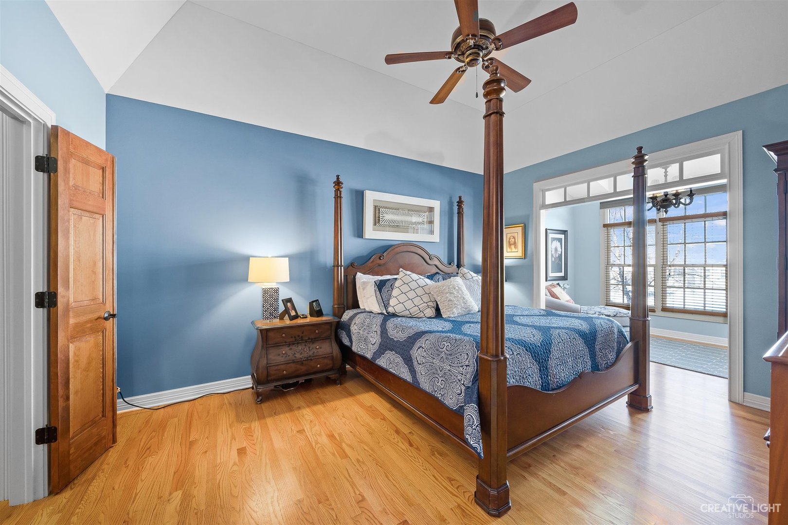 3509 Ridge Pointe Drive Geneva, IL 60134 - Photo 13 of 39 a bedroom with a bed and a chandelier