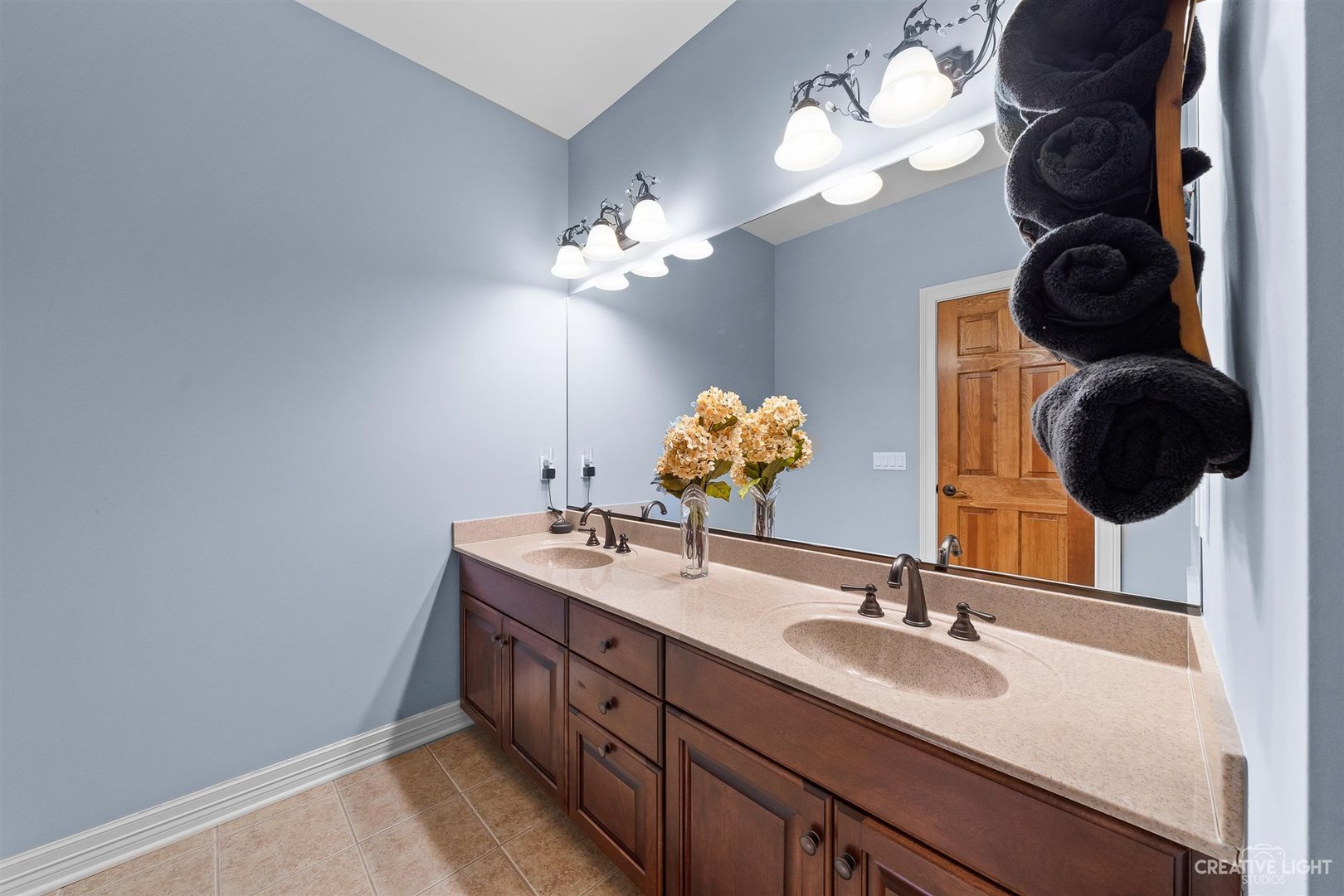 3509 Ridge Pointe Drive Geneva, IL 60134 - Photo 19 of 39 a bathroom with a double vanity sink and a mirror