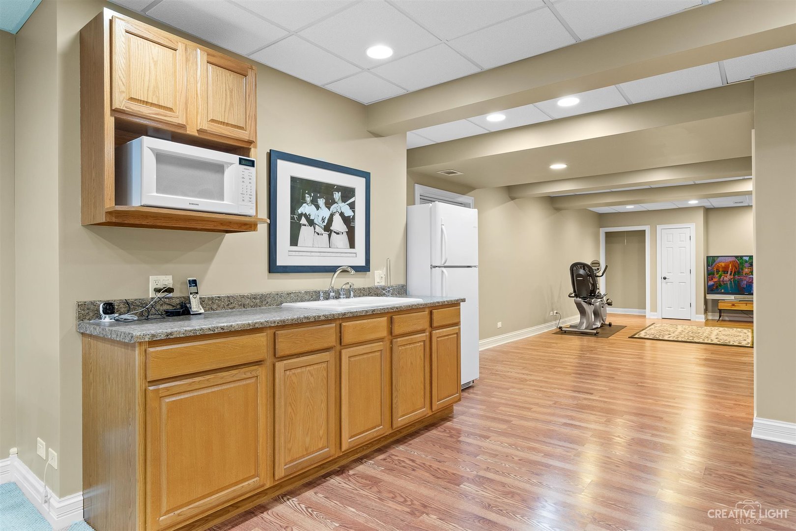 3509 Ridge Pointe Drive Geneva, IL 60134 - Photo 24 of 39 a kitchen with granite countertop a stove and white cabinets